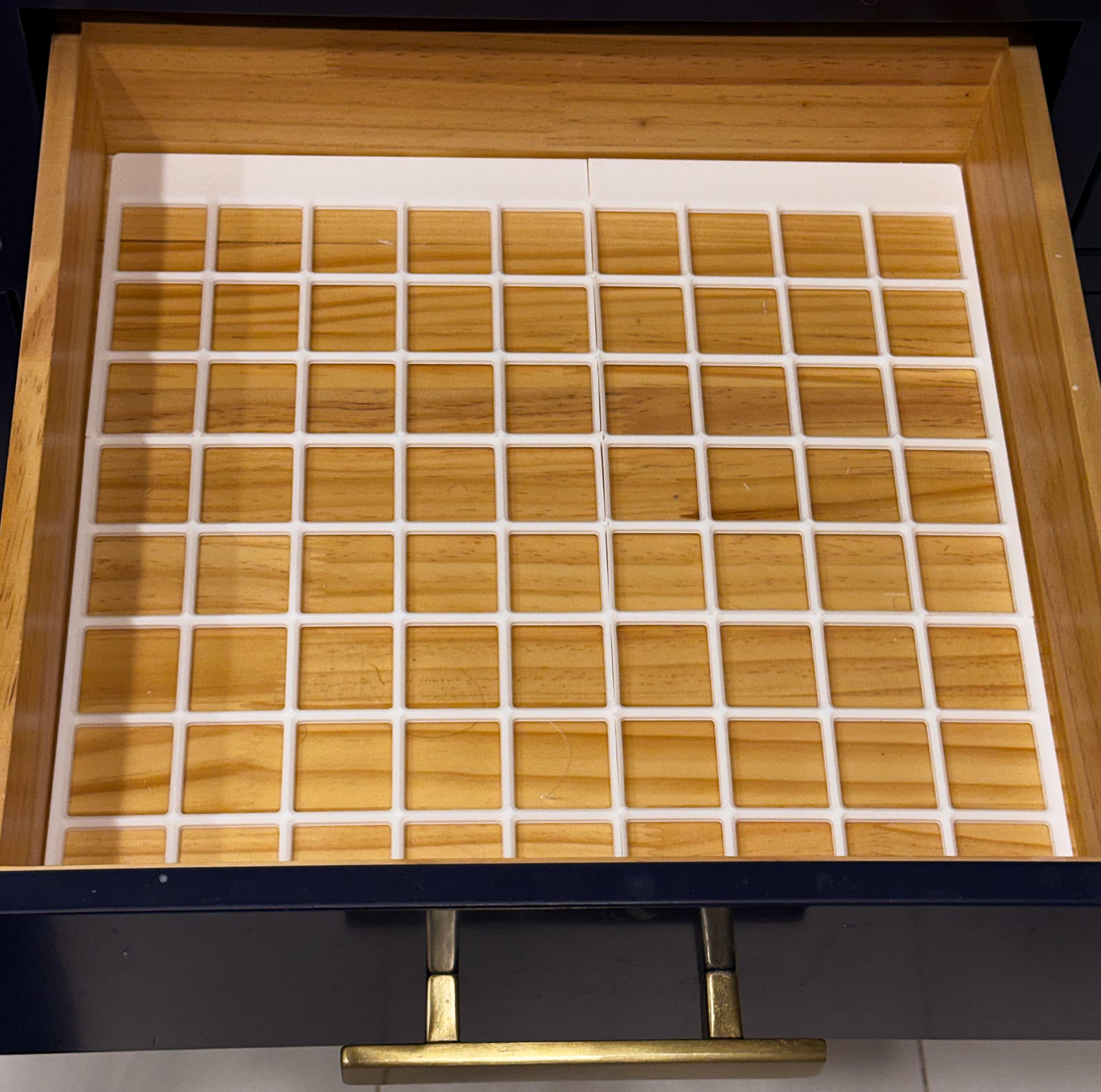 Printed Gridfinity baseplate fitted into drawer.