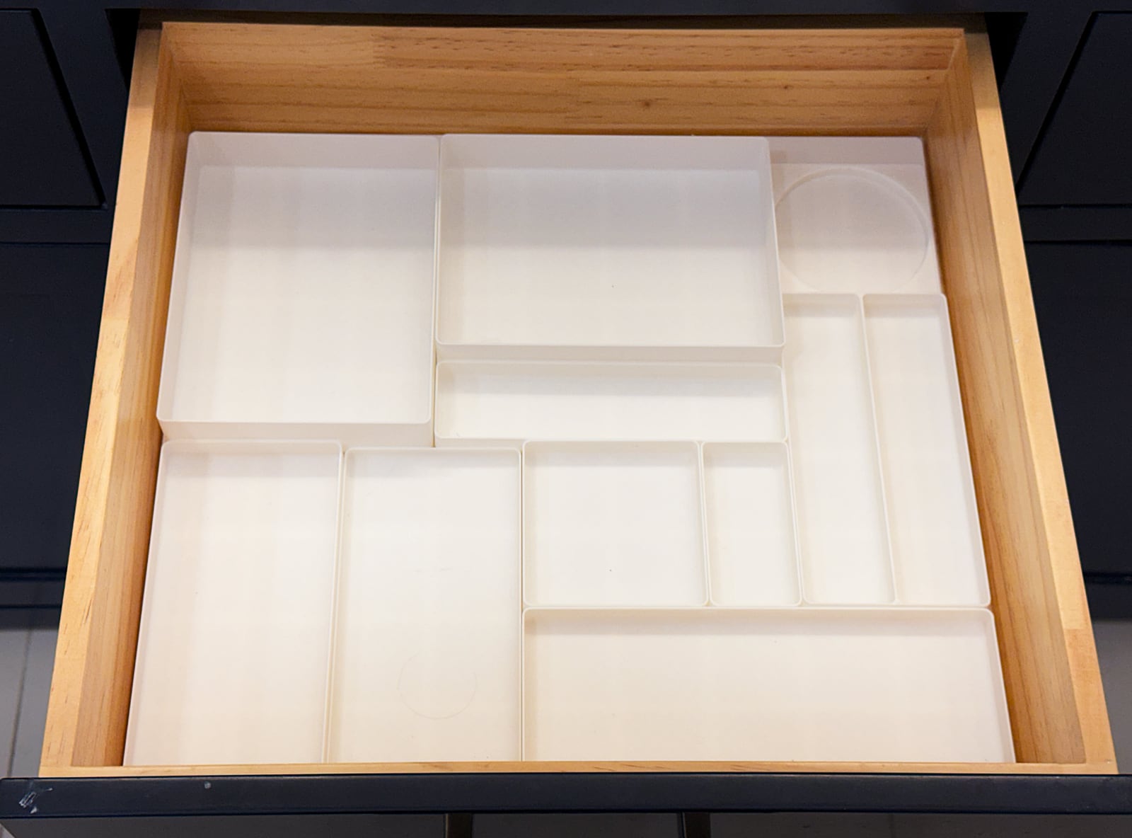 Drawer filled with empty Gridfinity containers of various grid dimensions and heights