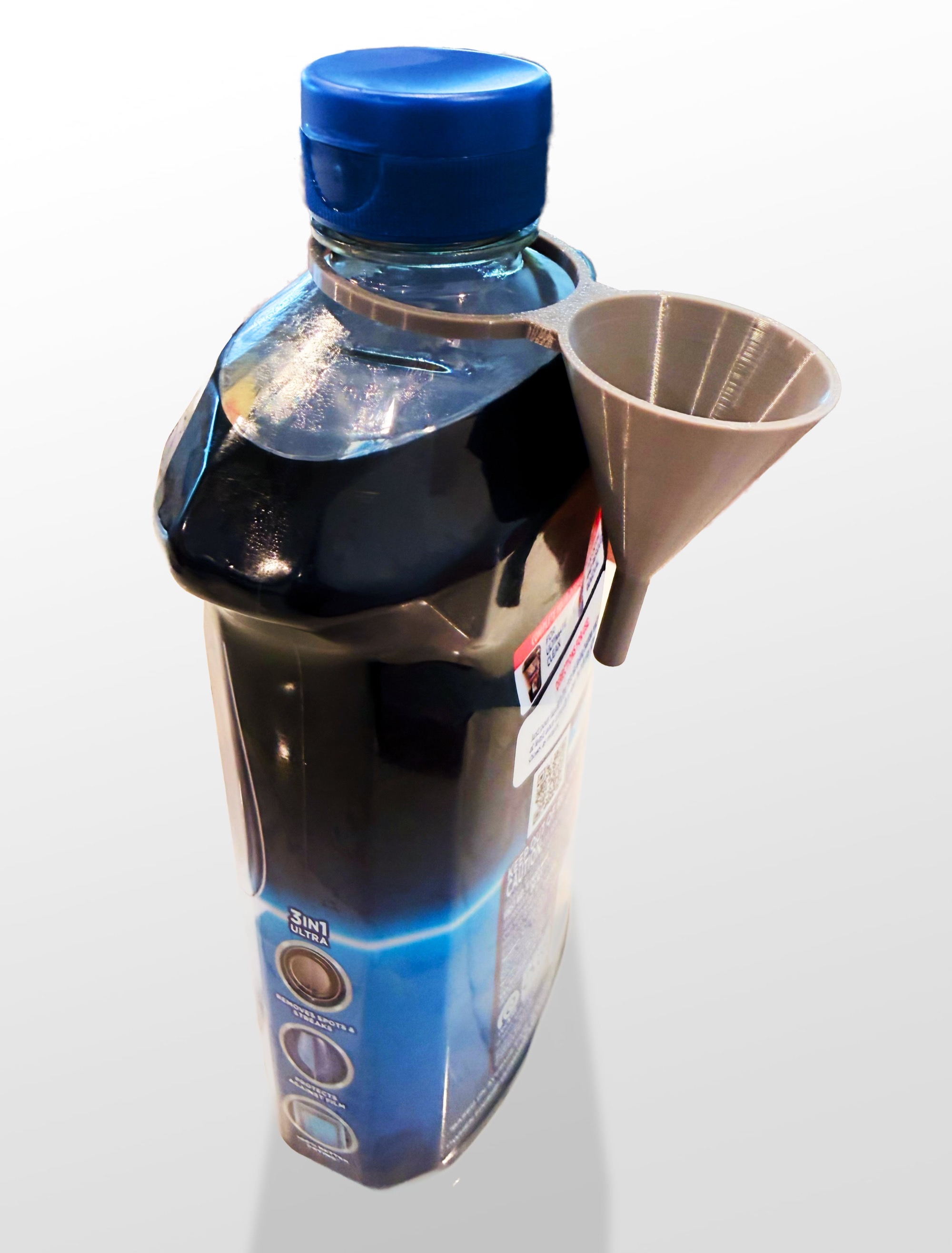 Jet-Dry rinse aid bottle with micro funnel hanging from cap.
