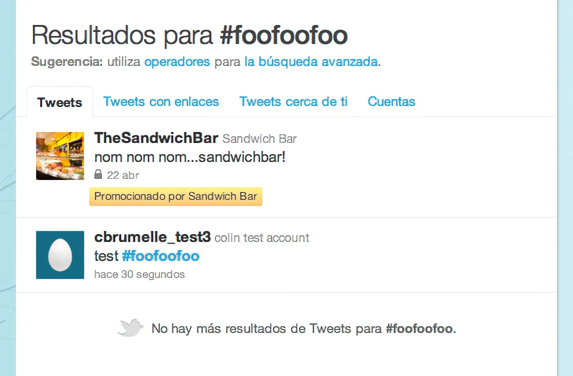 Search results on twitter.com showing a promoted tweet from @TheSandwichBar and below it a tweet from Colin's test account, 'Test. Hi. #FooFooFoo.'